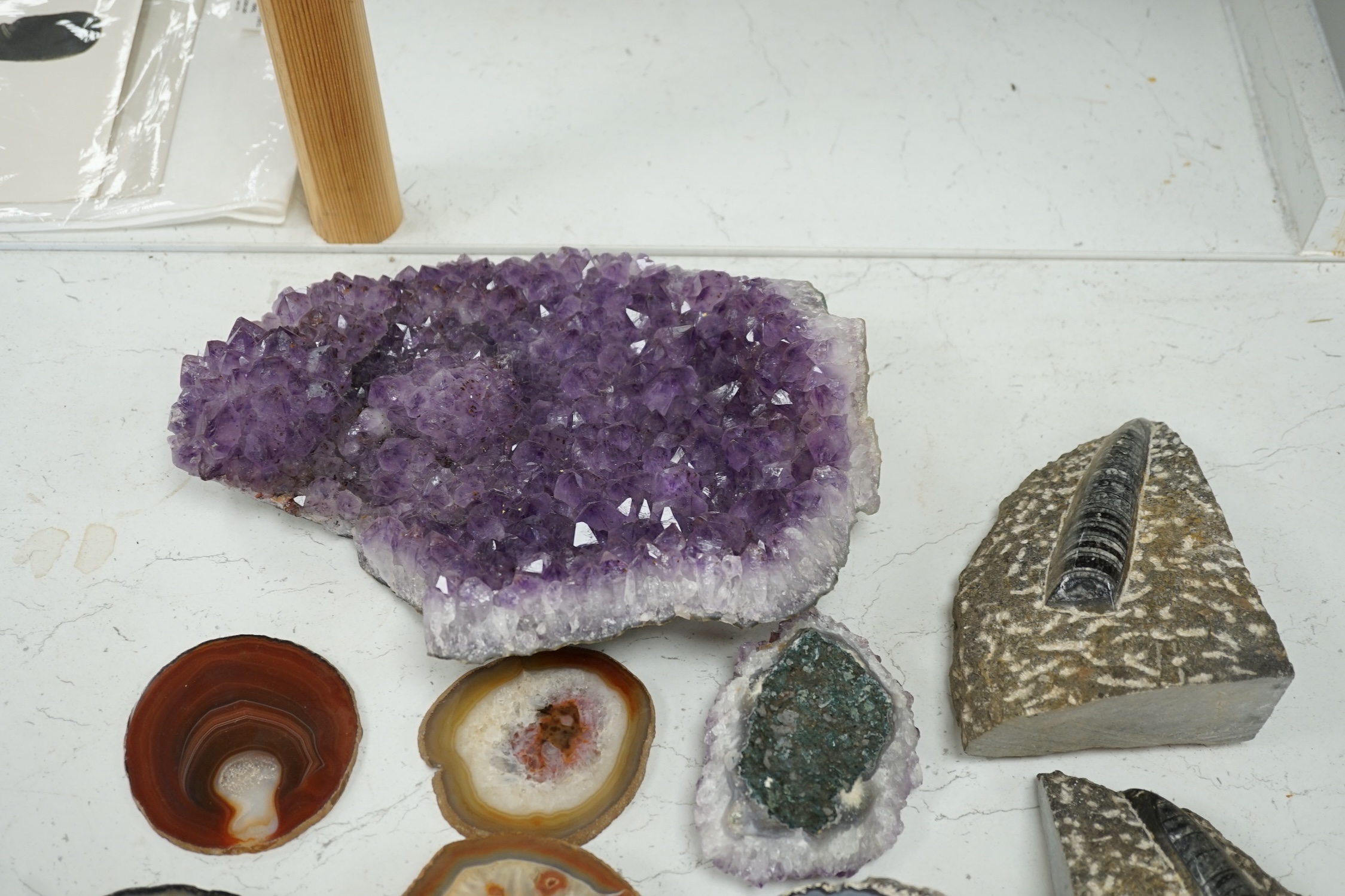 A group of mineral and fossil specimens, largest amethyst 26.5cm wide. Condition - good